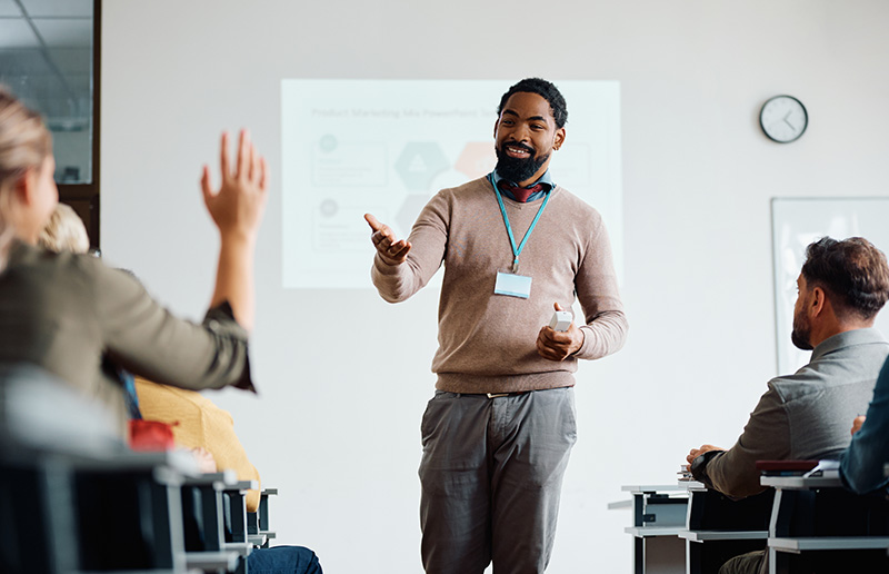 Instructor leading a internal seminar presentation